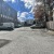 a street with cars and buildings on the side